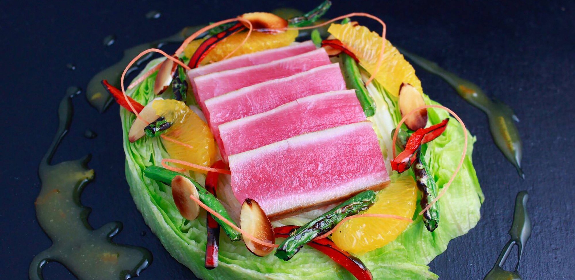 Seared Ahi tuna salad with Haliburton fire roasted red & green bell peppers and orange citrus vinaigrette