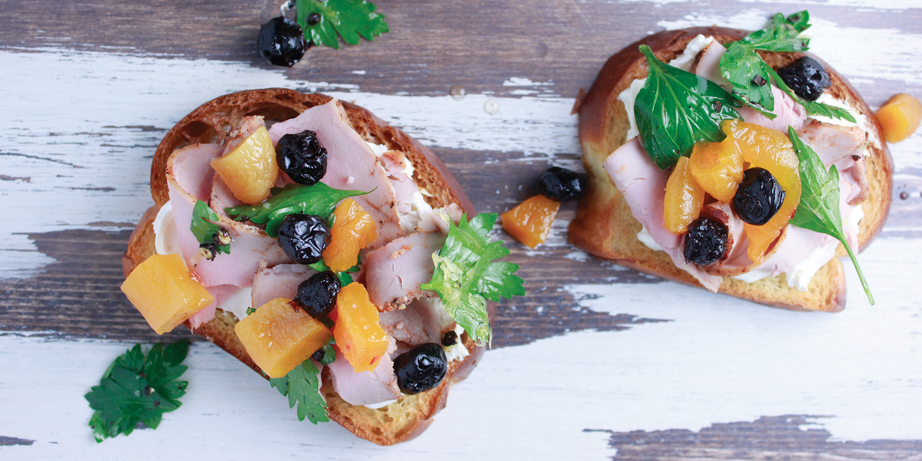 Smoked Pork Loin Toast featuring Haliburton pickled blueberries and spicy pickled apricot