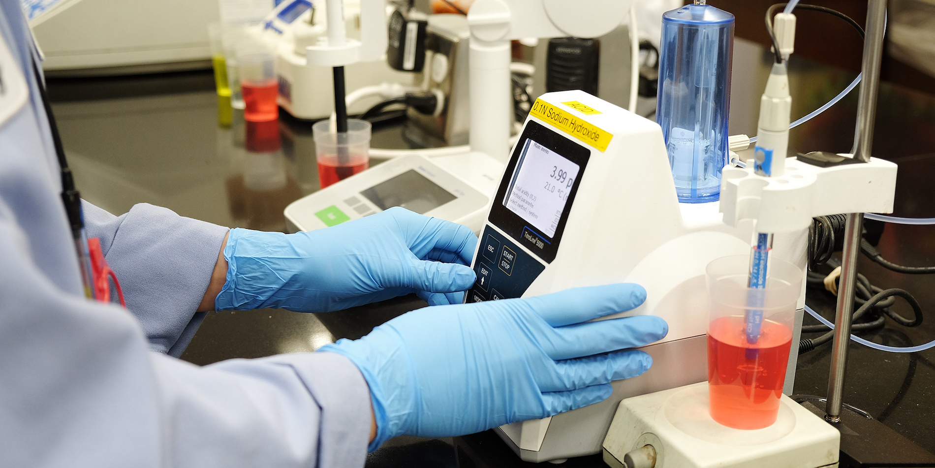 Quality team measuring acid content