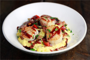 Pomegranate Reduction Sauce Featuring Haliburton Savory Creamed Corn and Fire Roasted Red & Green Bell Peppers