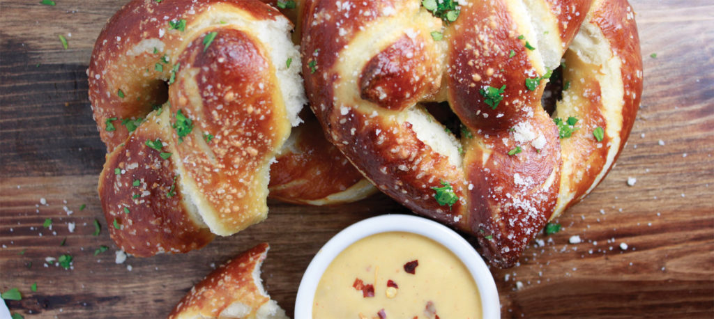 Spicy Cheese Sauce Featuring Spicy Smoked Gouda Cheese Sauce, Chipotle and Guajillo Chile seasonings.