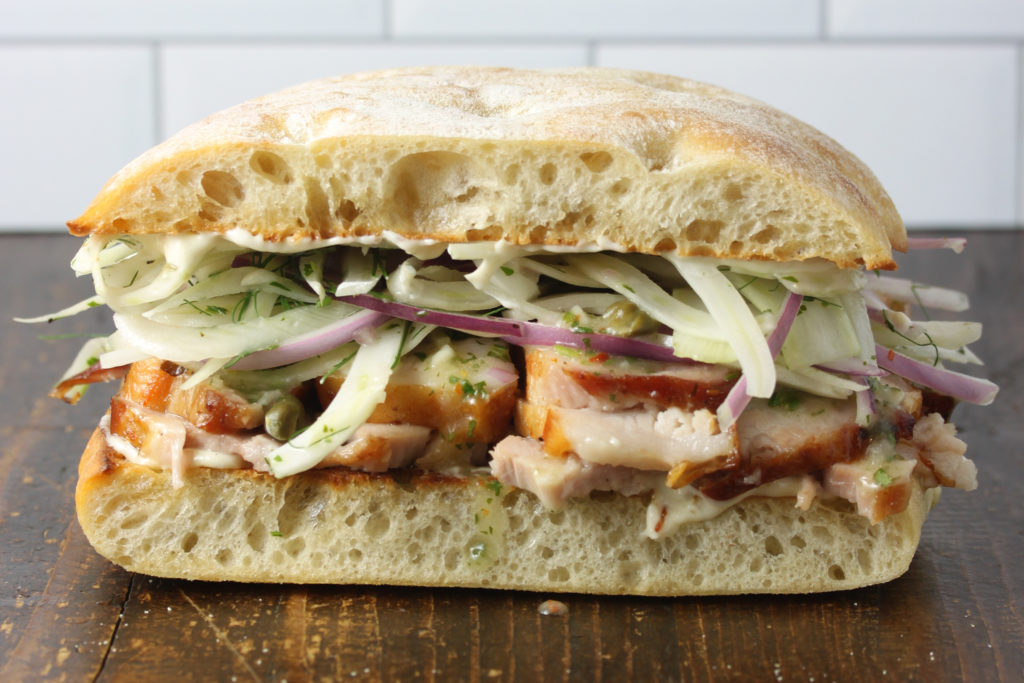 Italian Pork Belly Sandwich Featuring Haliburton’s certified ready-to-eat roasted garlic aioli, fennel slaw dressed with Italian herb vinaigrette.